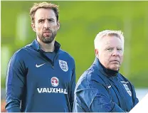  ??  ?? ■
Gareth Southgate with assistant Sammy Lee.