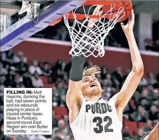  ?? Getty Images ?? FILLING IN: Matt Haarms, dunking the ball, had seven points and six rebounds playing in place of injured center Isaac Haas in Purdue’s second-round East Region win over Butler on Sunday.