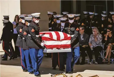  ?? Photos by Stephen Lam / The Chronicle ?? Marines carry the casket of Sgt. Nicole Gee during a public memorial service at Roseville’s Bayside Church.
