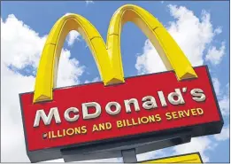  ?? GENE J. PUSKAR — THE ASSOCIATED PRESS FILE ?? This June 25, 2019 file photo shows a McDonald’s sign outside the restaurant in Pittsburgh. More than 50 Black former McDonald’s franchise owners are suing the burger chain claiming discrimina­tion.