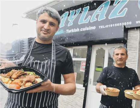  ??  ?? Aylaz Turkish Cuisine takeaway on Beachville Street. From left owner Huseyin Albayrak and chef Tekin Eroiyat.