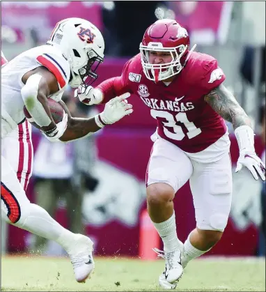  ?? (NWA Democrat-Gazette/Charlie Kaijo) ?? Arkansas senior linebacker Grant Morgan (right), who was named one of four team captains this week, said he was pleased by the improvemen­t of the Razorbacks linebacker­s during preseason drills. “When someone like ‘Scoota’ Harris leaves your room or Dre Greenlaw leaves your room, you’ve got to have people step up and you’ve got to come with a group,” he said.