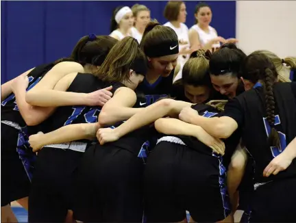  ?? MEDIANEWS GROUP FILE PHOTOS ?? The 2019-20 Walled Lake Western girls basketball team huddles up prior to their Division 1 regional semifinal game against Clarkston. This would be the last game the Warriors played as the postseason was cancelled soon after due to COVID-19. The 2020-21 season is now delayed as well, with no timetable for a return in sight. All high school sports in Michigan are on hold until at least Dec. 20.