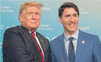  ?? SAUL LOEB/AFP/GETTY IMAGES ?? President Donald Trump and Canadian Prime Minister Justin Trudeau, shown in June, both had praise for the new trade agreement between the United States, Canada and Mexico.