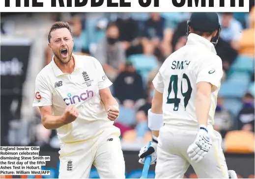  ?? ?? England bowler Ollie Robinson celebrates dismissing Steve Smith on the first day of the fifth Ashes Test in Hobart. Picture: William West/AFP