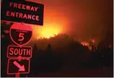  ?? HUNG T. VU/THE RECORD SEARCHLIGH­T VIA AP ?? Wildfires burn on the ridge line east of Interstate 5 near Shasta-Trinity National Forest in California.