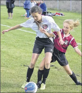  ?? TRURO DAILY NEWS PHOTO ?? CC Riders faced Cole Harbour Eastern Passage in their opening game of the U-13 A soccer finals. Here, Lienna Story-Trefry, right, of the CC Riders tries to get the ball from Paige Connors of Cole Harbour Eastern Passage. Truro won the game 3-0.