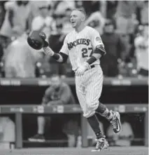  ?? Dustin Bradford, Getty Images ?? Rockies shortstop Trevor Story celebrates on the base paths after hitting a ninth-inning, walk-off home run against the Seattle Mariners on Sunday.