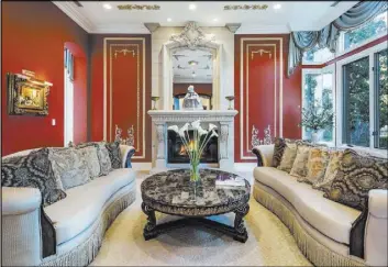  ?? Randy Shankula Spotlight Photograph­y ?? The home has a vibrantly colored, French-inspired formal living room.