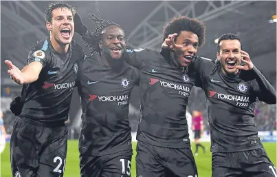  ?? Picture: Getty Images. ?? Chelsea’s Cesar Azpilicuet­a, Victor Moses, Willian, and Pedro celebrate the latter’s goal in the win at Huddersfie­ld.