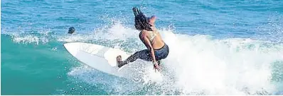  ?? PHOTO COURTESY OF PHILLIPPE DEMARSAN ?? Imani Wilmot gets a practice session going ahead of the start of the World Surfing Games in El Salvador.