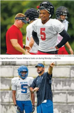  ?? STAFF PHOTO BY C.B. SCHMELTER STAFF PHOTO BY C.B. SCHMELTER ?? Signal Mountain’s Travion Williams looks on during Monday’s practice. Red Bank coach Chris Brown talks with Calvin Jackson on Monday.