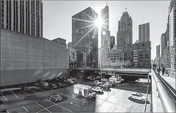  ?? BRIAN CASSELLA/CHICAGO TRIBUNE ?? Cityfront Plaza was envisioned as a front door for the buildings around it. Yet it is still surrounded by surface parking lots.