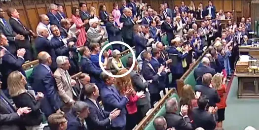  ?? ?? Sitting MP: Theresa May, circled, fails to stand and applaud outgoing PM Boris Johnson in the Commons yesterday, right