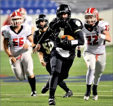  ?? Special to the Democrat-Gazette/JIMMY JONES ?? Charleston quarterbac­k Ty Storey
(4) runs away from Glen Rose defenders Scott Kehner (22) and Justin Salazar (56) in the first half of the Tigers’ 42-19 victory in the Class 3A state championsh­ip game at War Memorial Stadium in Little Rock. Storey...