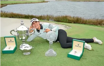  ?? GETTY IMAGES ?? Lydia Ko with the spoils of success after a winning weekend on the LPGA Tour .