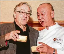  ?? Gary Fountain / Contributo­r ?? Robert De Niro, left, and chef Nobu Matsuhisa attend the sake ceremony marking Nobu Houston’s official grand opening.