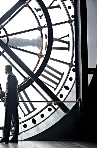  ??  ?? The Duke and Duchess take in the view through the clock at the Musée d’Orsay