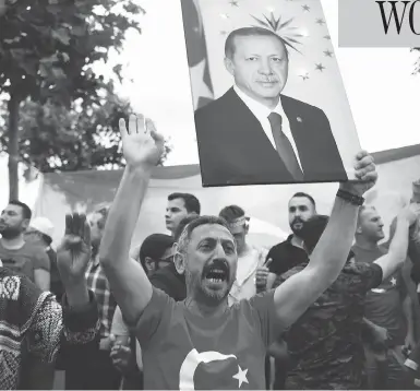  ?? JEFF J. MITCHELL / GETTY IMAGES ?? Supporters of Turkish President Recep Tayyip Erdogan celebrate outside AK party headquarte­rs in Istanbul, Sunday.