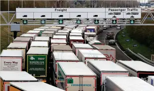  ?? GARETH FULLER/ASSOCIATED PRESS ?? Trucks — they call them lorries there — were backed up trying to enter the Channel Tunnel from England to France after French customs workers protested in March over the effect Brexit will have on cross-channel shipping.