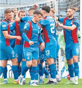  ?? ?? Caley Thistle players celebrate Billy Mckay’s penalty strike