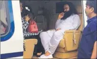  ??  ?? ■ GROUNDED: Gurmeet Ram Rahim Singh and his aide, Honeypreet, being flown to Sunaria jail near Rohtak after he was convicted by a CBI court in Panchkula on August 25, 2017.