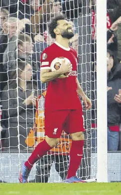 ?? ?? Liverpool’s Mohamed Salah reacts after his goal was disallowed for offside during Thursday’s stunning 3-0 defeat by Atalanta in the quarterfin­als of the Europa League