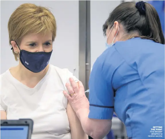  ??  ?? GETTING THE POINT First Minister delighted to receive vaccine