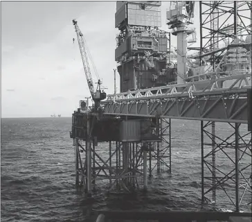  ??  ?? Total’s Elgin rig in the North Sea is leaking potentiall­y explosive gas. An industry auditor says the leak, which occurred above the water line on the rig itself, could have been prevented by fail-safe mechanisms.