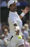  ?? Ben Curtis ?? The Associated Press Novak Djokovic returns the ball to Kevin Anderson during their Wimbledon men’s singles final Sunday in London.