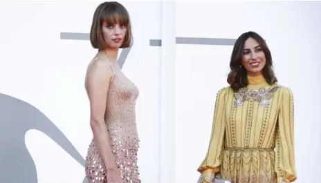  ?? PHOTO BY JOEL C RYAN/INVISION/AP ?? Actress Maya Hawke (left) and director Gia Coppola pose for photograph­ers upon arrival at the premiere for the film ‘Mainstream’ during the 77th edition of the Venice Film Festival in Venice, Italy, on Saturday.