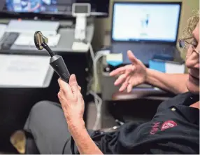  ?? JAKE CRANDALL/ ADVERTISER ?? Rita Jennings, RN shows the bluetooth stethoscop­e that allows a doctor in Montgomery to asses a patient at the Medical Advocacy and Outreach office in Selma, Ala., on Wednesday, Sept. 4, 2019.