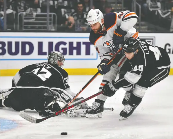  ?? GARY A. VASQUEZ/USA TODAY SPORTS ?? Kings centre Blake Lizotte helps goalie Jonathan Quick defend against Oilers winger Zack Kassian during Game 4 of their first-round playoff series at Crypto.com Arena. The Kings' 4-0 victory evened the series at two games apiece.
