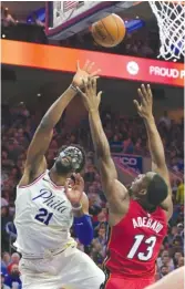  ??  ?? Sixers center Joel Embiid, who had 19 points and 12 rebounds, shoots over the Heat’s Bam Adebayo on Tuesday in Philadelph­ia. DREWHALLOW­ELL/ GETTY IMAGES