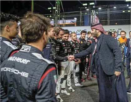  ?? Picture: Reuters ?? Saudi Crown Prince and Prime Minister Mohammed bin Salman meets the drivers before a Formula-E race at Diriyah Race Track in Riyadh. Major boxing matches, premier golf tournament­s and Formula One Grands Prix have been hosted in Saudi Arabia.