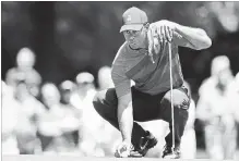  ?? ASSOCIATED PRESS FILE PHOTO ?? Tiger Woods lines up a putt at the Wells Fargo Championsh­ip at Quail Hollow Club in Charlotte, N.C.