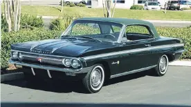  ??  ?? Introduced in 1961, the F-85 Jetfire Sport Coupe was a trim, attractive, compact powered by an overhead valve engine.