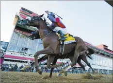  ?? AP photo ?? Swiss Skydiver, with Robby Albarado aboard, edges Authentic to win the 145th Preakness Stakes on Saturday.