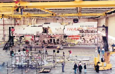  ?? VIC DELUCIA/THE NEW YORK TIMES ?? Wreckage recovered from TWA Flight 800 is assembled inside a hangar July 11, 1997, in Calverton, New York. The National Transporta­tion Safety Board has announced plans to decommissi­on and destroy the remaining wreckage.