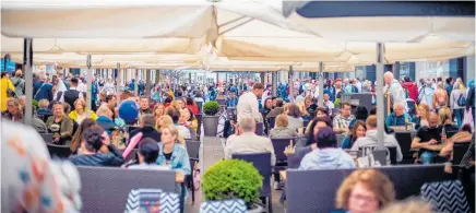  ?? Photo / Bloomberg ?? Shoppers and diners in Hamburg, Germany. Europe’s consumers are being squeezed by rising prices, especially for energy.