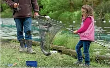  ?? MURRAY WILSON/STUFF ?? Maria Tamim, 7, takes part in the children’s fishing day at Hokowhitu Lagoon.