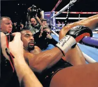  ??  ?? FEELING ROPEY Haye lands at ringside after Bellew blitz in 11th