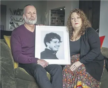  ?? ?? Andrew and Joanne Doody with a photo of their son Peter.