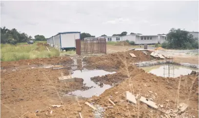  ?? Picture:Nigel Sibanda ?? WATERLOGGE­D. A yard under constructi­on at Theresa Park Secondary school in Pretoria, where parents have been protesting at the inaction of the Gauteng education department.