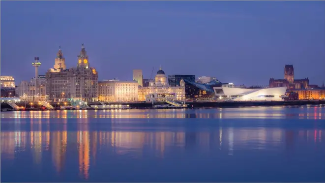  ??  ?? Liverpool has changed dramatical­ly in recent years, and while the waterfront benefits from a modern sheen it’s still evocative of the city’s rich maritime heritage. Below, Mark is pictured with the highly impressive Jaguar XJ