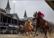  ?? MATT SLOCUM - THE ASSOCIATED PRESS ?? FILE - In this May 4, 2019, file photo, Luis Saez rides Maximum Security, right, across the finish line first against Flavien Prat on Country House during the 145th running of the Kentucky Derby horse race at Churchill Downs in Louisville, Ky.