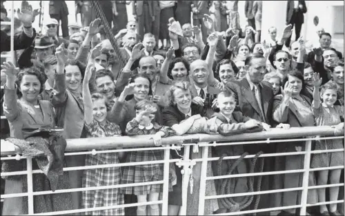  ??  ?? TURNED AWAY: In this June 17, 1939, file photo, German Jewish refugees return to Antwerp, Belgium, aboard the St. Louis after they had been denied entrance to Cuba and the United States. More than 76 years later, fresh angst about whether to admit...