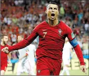  ?? AP/FRANCISCO SECO ?? celebrates after scoring on a penalty kick in the third minute of Friday’s World Cup match in Sochi, Russia. Ronaldo scored three goals in the 3-3 tie.