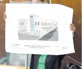  ?? IAN ALLEN/PHOTOGRAPH­ER ?? Juliet Cuthbert-Flynn, member of parliament for St Andrew West Rural, displays a diagram of what the new Lawrence Tavern Health Centre will look like. She was making her contributi­on to the 2021 State of the Constituen­cy Debate on Tuesday.