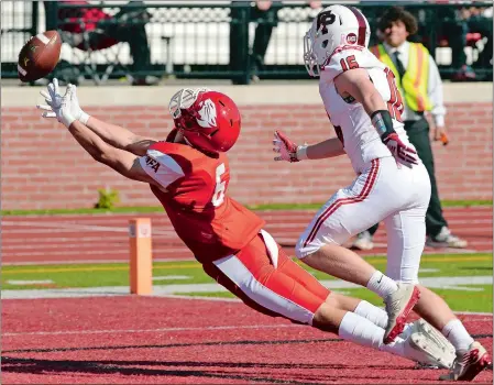  ?? DANA JENSEN/THE DAY ?? NFA’s Andrew Cote (6) dives in the end zone for a potential touchdown pass with Fairfield Prep’s Aidan Derby (16) trailing, but the ball is just out of reach during the Wildcats’ 33-28 loss to the Jesuits on Saturday in Norwich. Visit www.theday.com for a photo gallery.